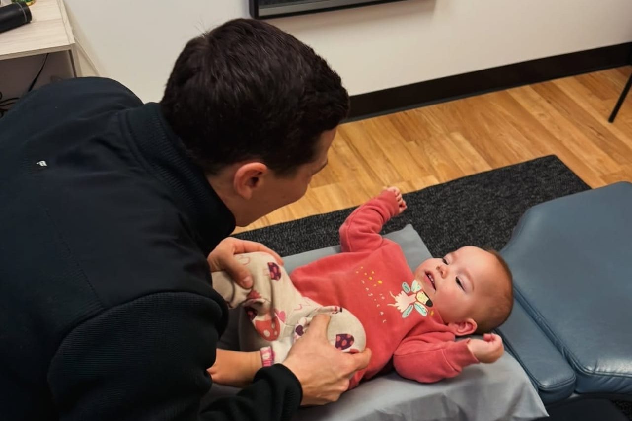 Gentle chiropractic care for a baby at Full Swing Healthcare in Jacksonville, FL
